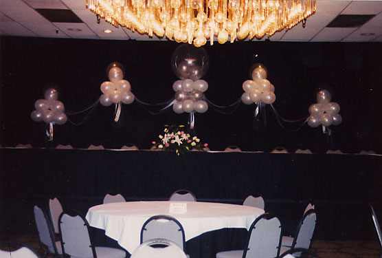 Lighted pedestal with garland arch at Doubletree Hotel